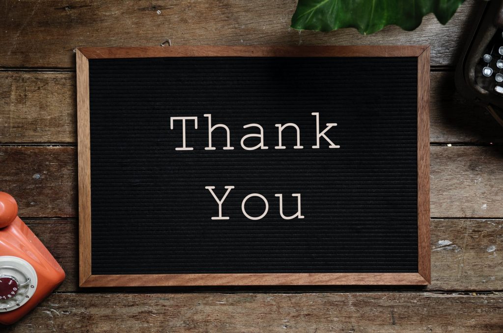 A sign which reads "Thank you"